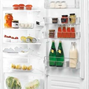 Inside view of the Indesit IBC12AC21R built-in fridge with Energy F efficiency, showing shelves and storage drawers in a white 122 cm design.